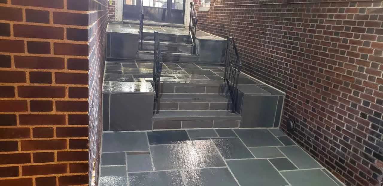 Completed bluestone entrance steps and landing from AJT’s masonry project gallery