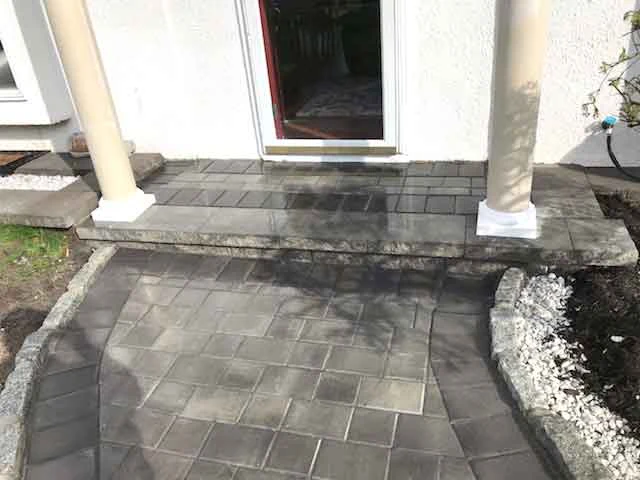 Paver landing at a home entrance from AJT’s masonry project gallery