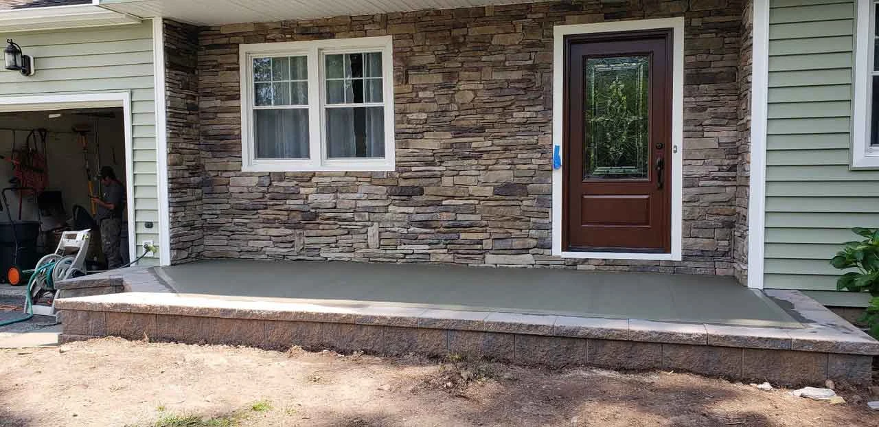 Stone veneer on the front of a home from AJT’s masonry project gallery